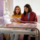 Nathalie Morris as Olympia “Oly” Chalmers-Davis and Safia Arain as Reema in Bump